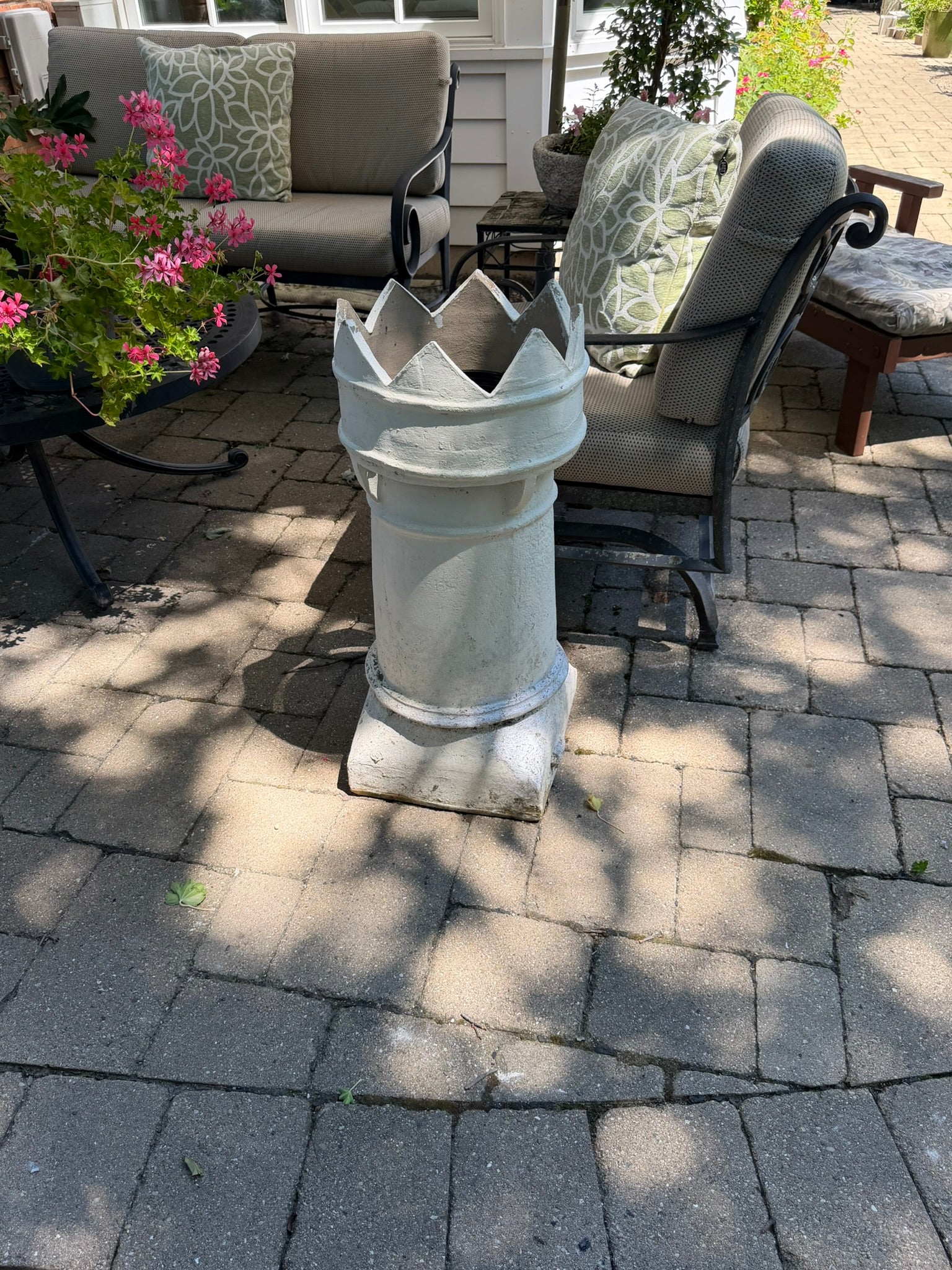 This is a vintage English crown chimney pot that has been painted white.