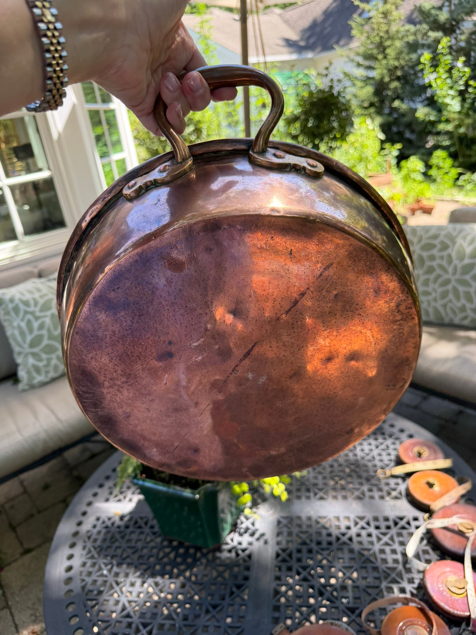 Exterior patina of antique English copper jam pan showing authentic age and use.